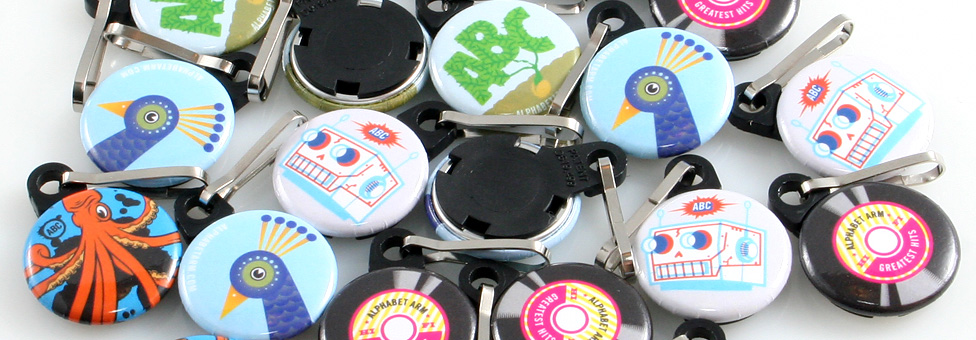 Alphabet Arm Design - 1" Round Custom Zipper Pulls